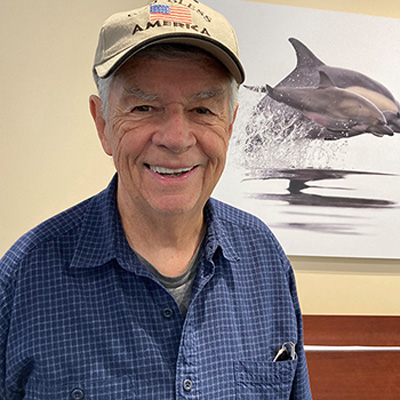 Photograph of woodcarving artist and Ventura Townehouse resident William Mesko