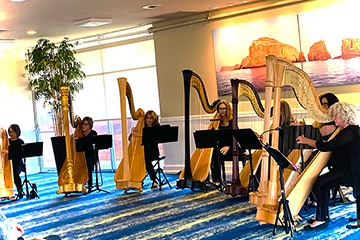The Ventura Townehouse Vista Room, shown with a group of harpists