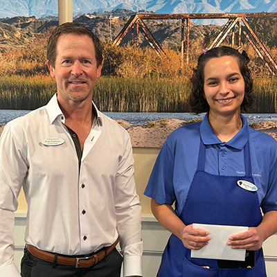 Sephra Martinez March 2026 Employee of the Month pictured with Executive Director Evan Granucci